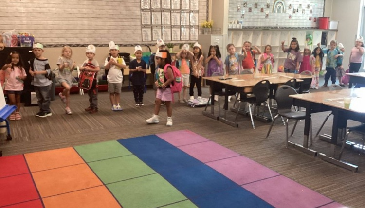 kindergarteners standing in a line ready to go home