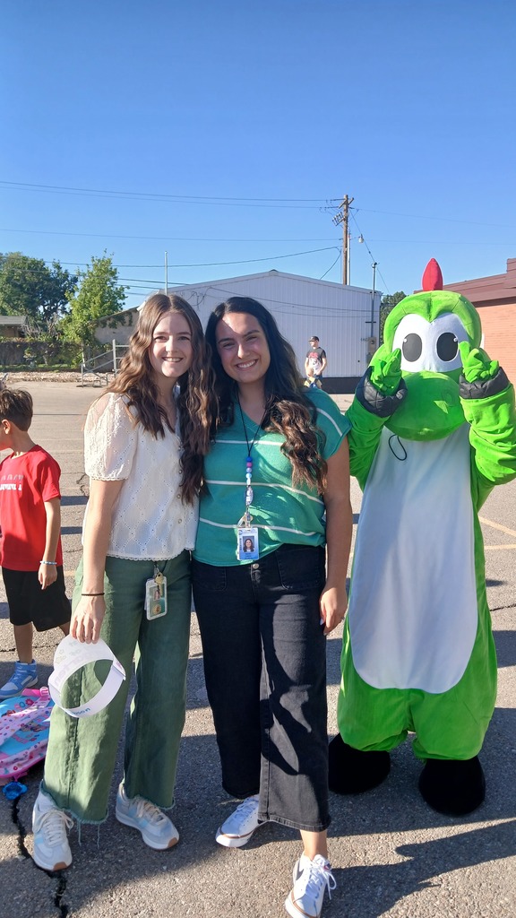 Mrs. Dobson and Mrs. Olsen posing for a picture, ready to start the 1st day of kindergarten with their new students