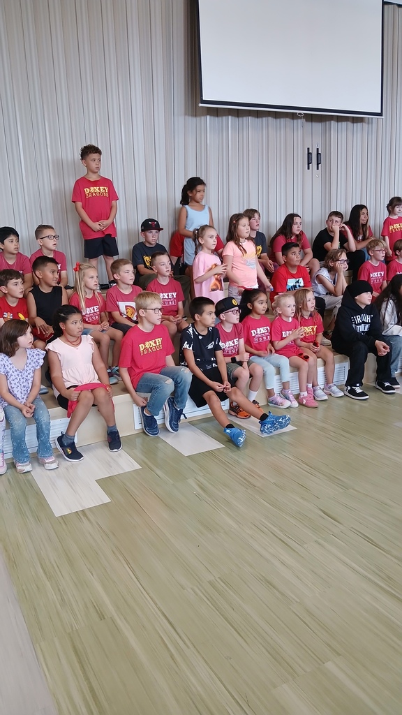 Amistand house wearing red t-shirts in their house activity.