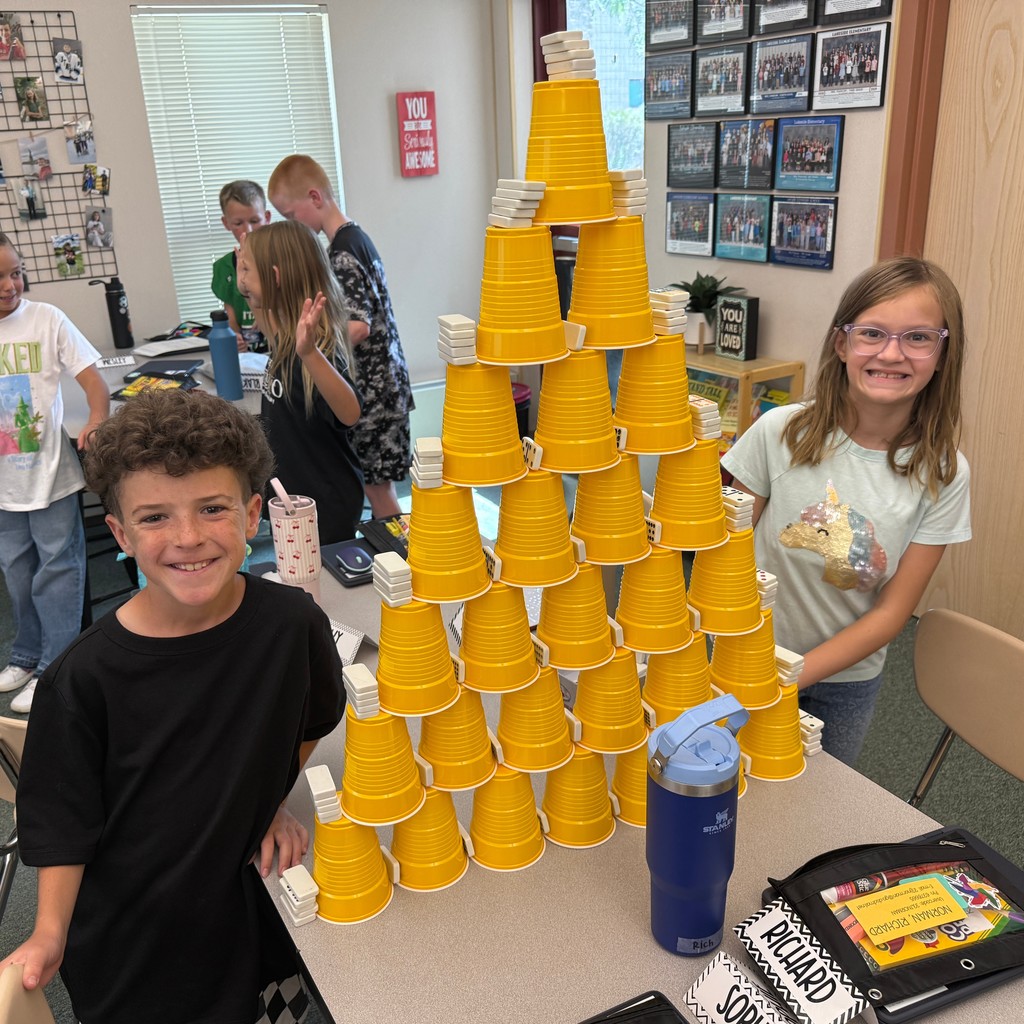 Students building a cup tower.