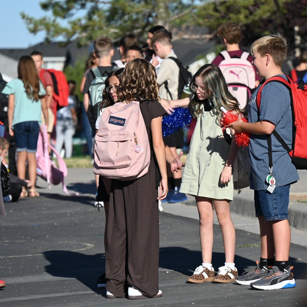 Students gather on the playground. 