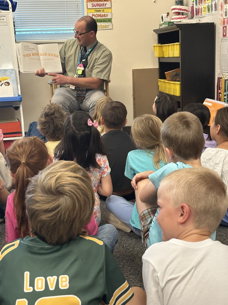 mr. green reading to first graders