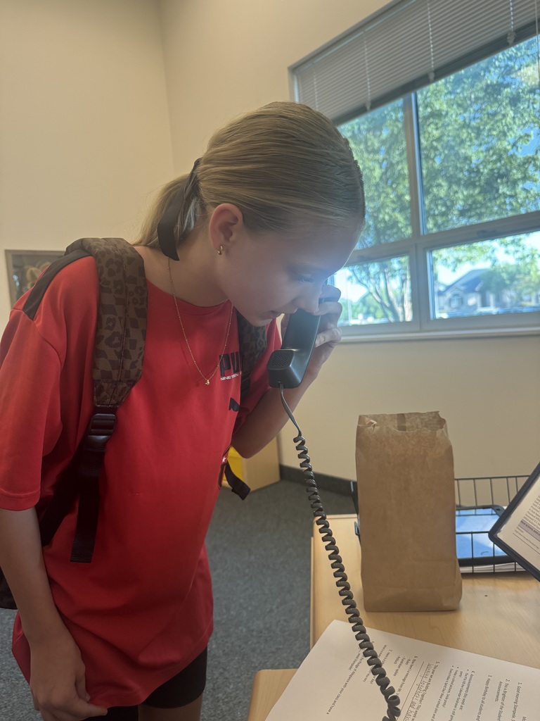 student doing morning announcements