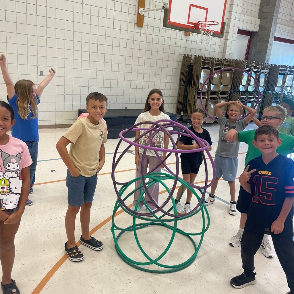 Students build with hulahoops in P.E.