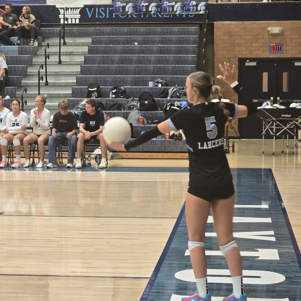 Lancers serving the volleyball
