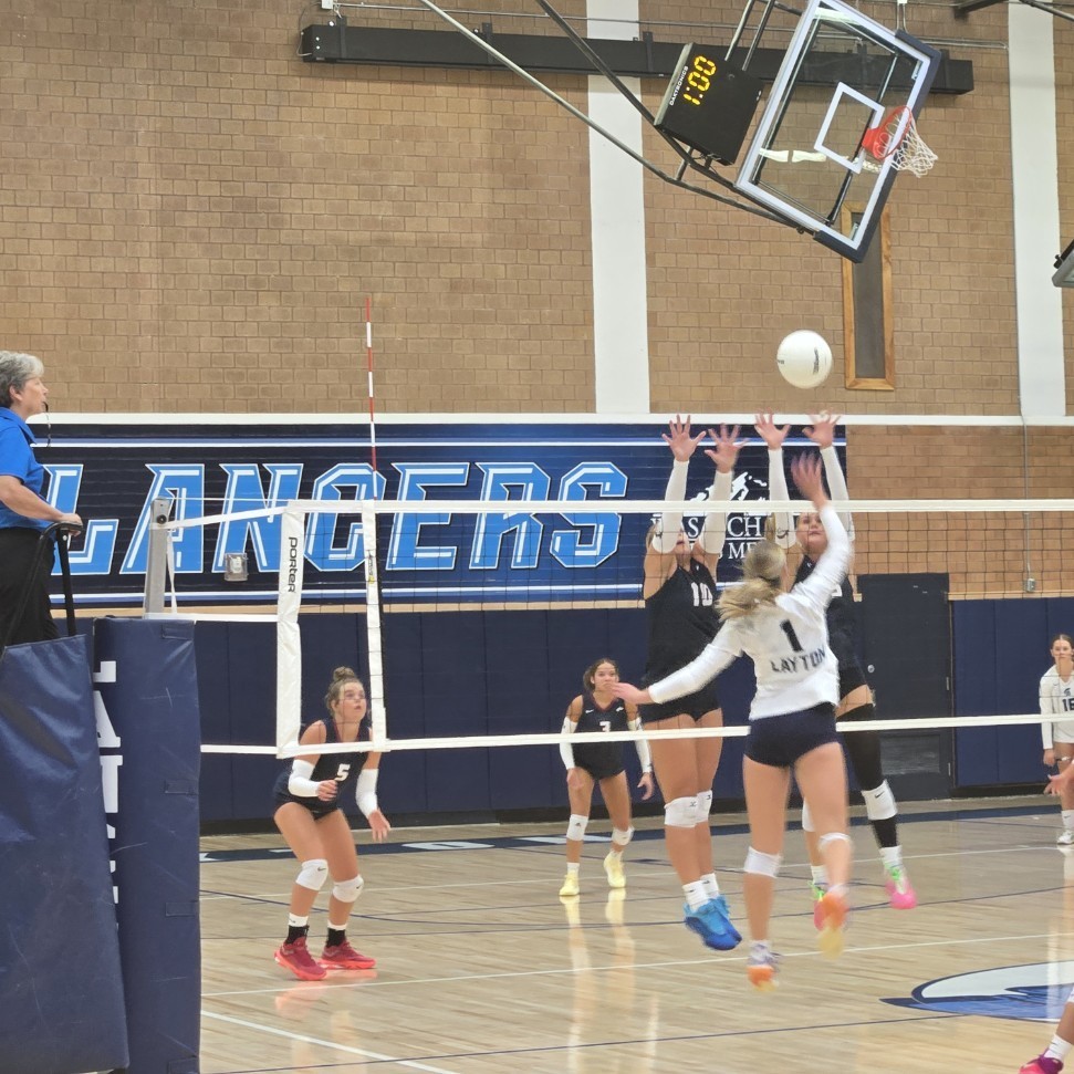 Layton volleyball player about to spike the ball