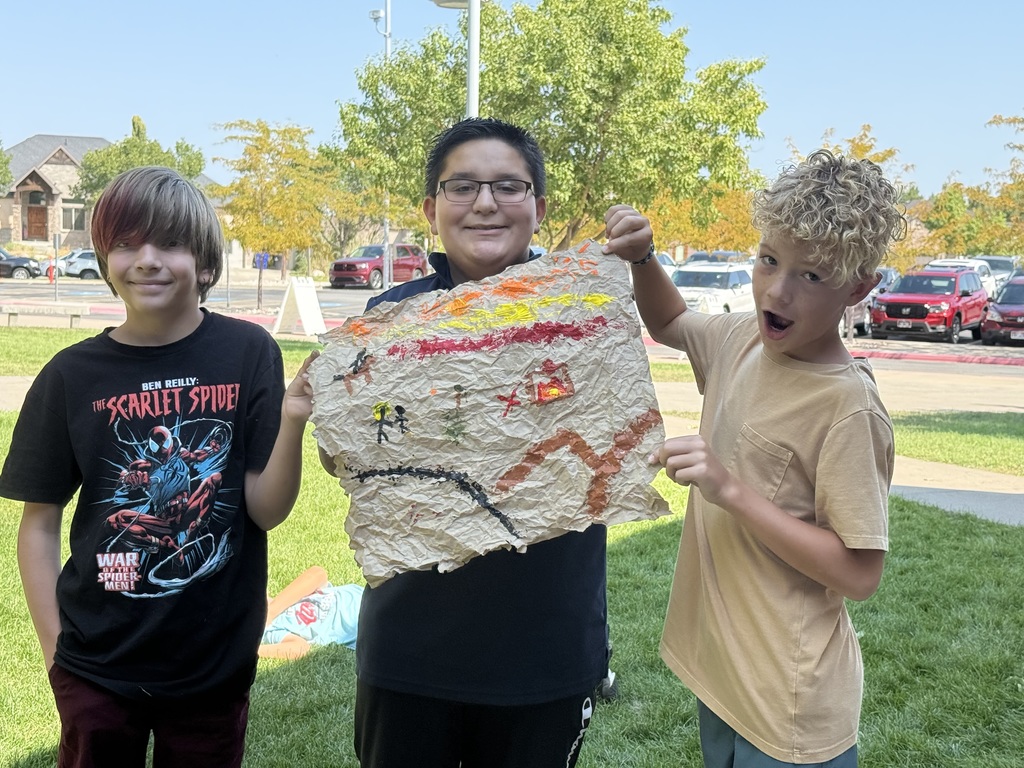 students showing completed cave paintings