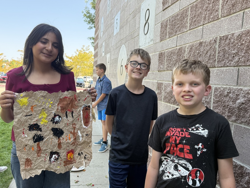 students showing completed cave paintings