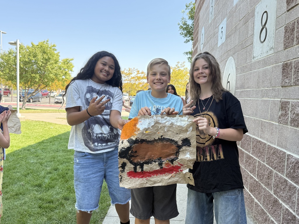 students showing completed cave paintings