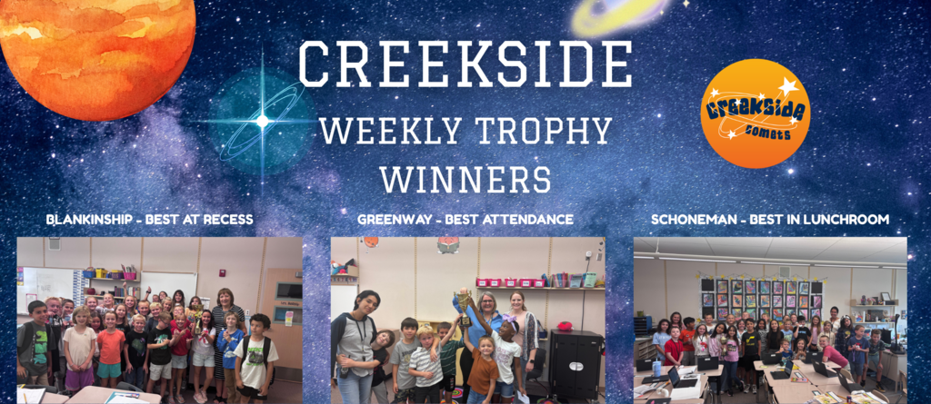 students in classroom holding trophy for best at winners