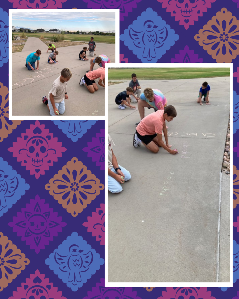 Students outside drawing with chalk
