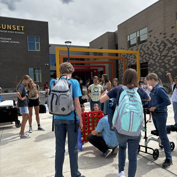 Students playing with a jumbo Connect Four game  