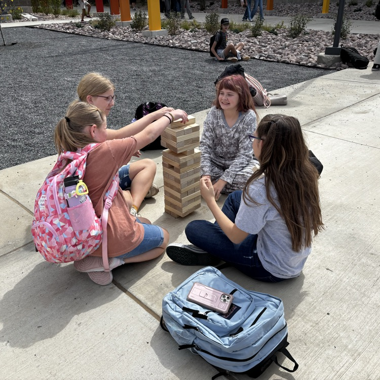 Students playing jumbo Jenga game