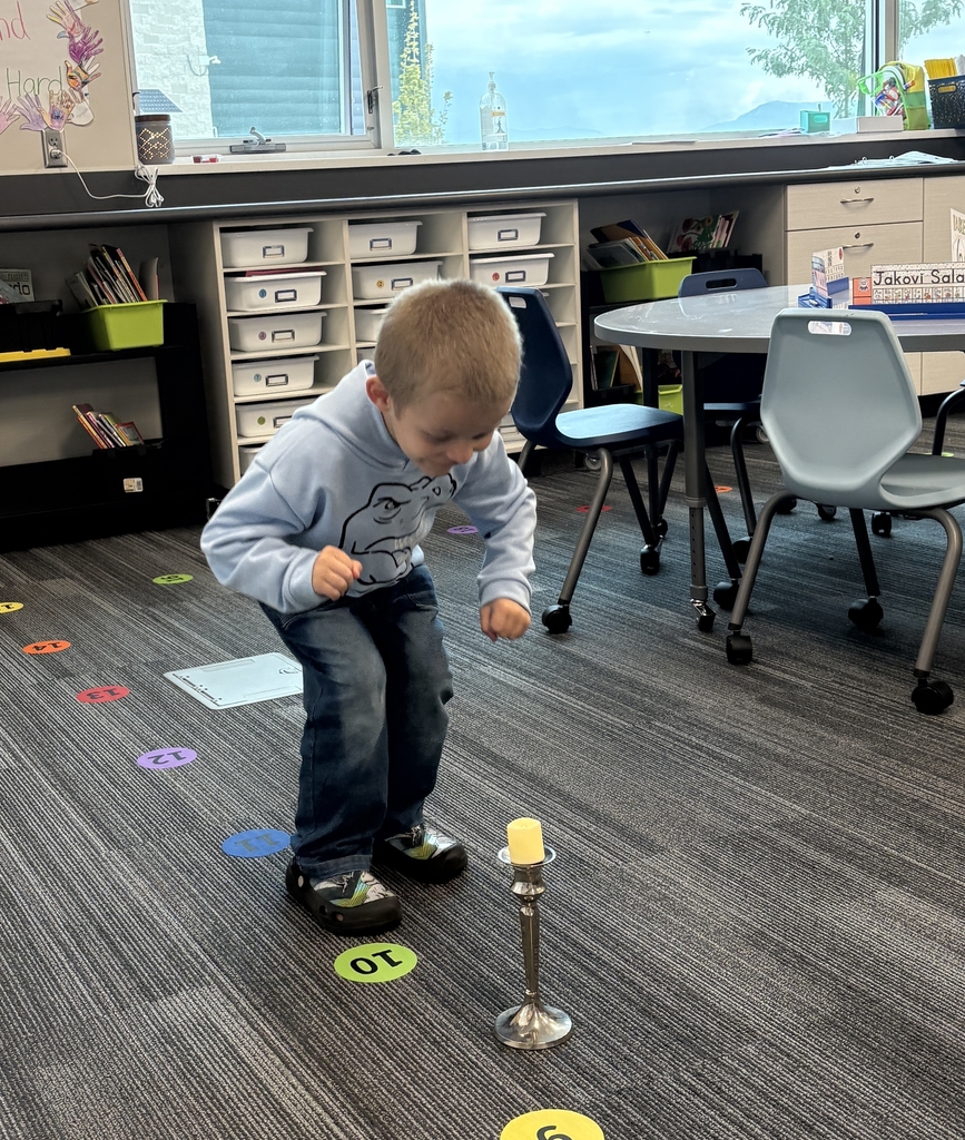 Boy looking down at a candlestick