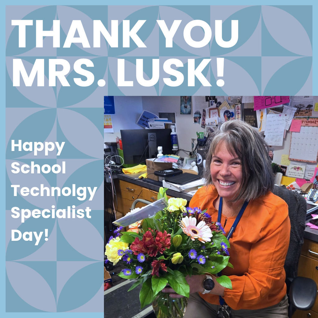 picture of Mrs. Lusk receiving flowers for school technology specialist day