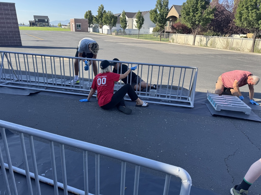 volunteers painting bike racks