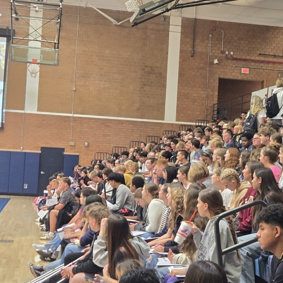 senior students in the stands watching the assembly
