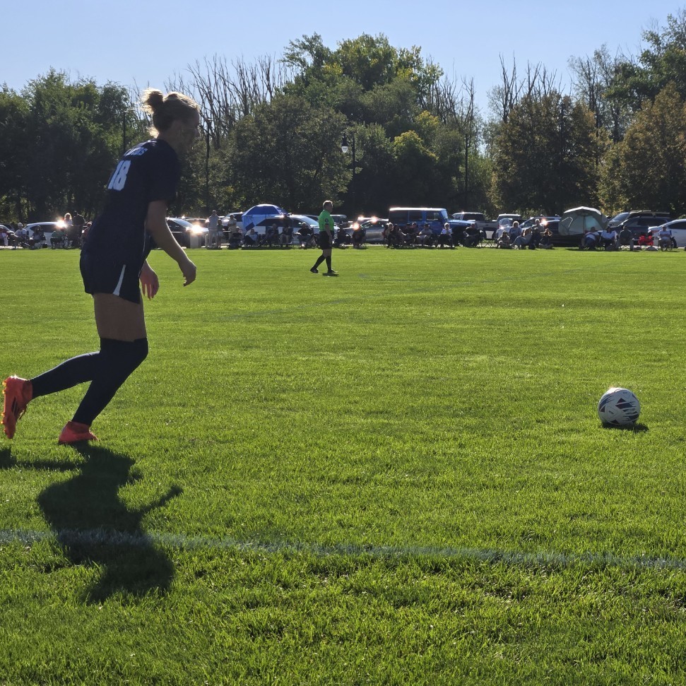 soccer player about to kick the ball