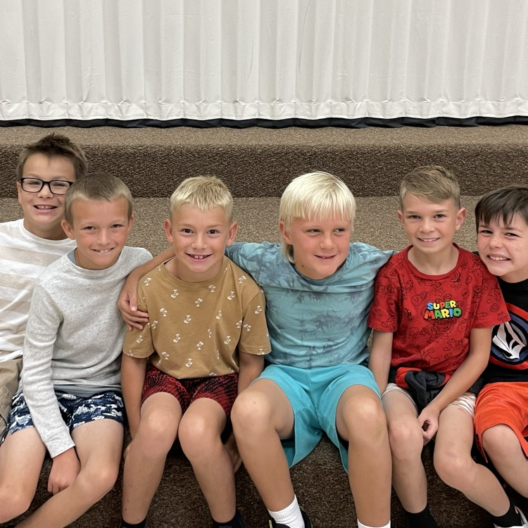 students sitting together smiling