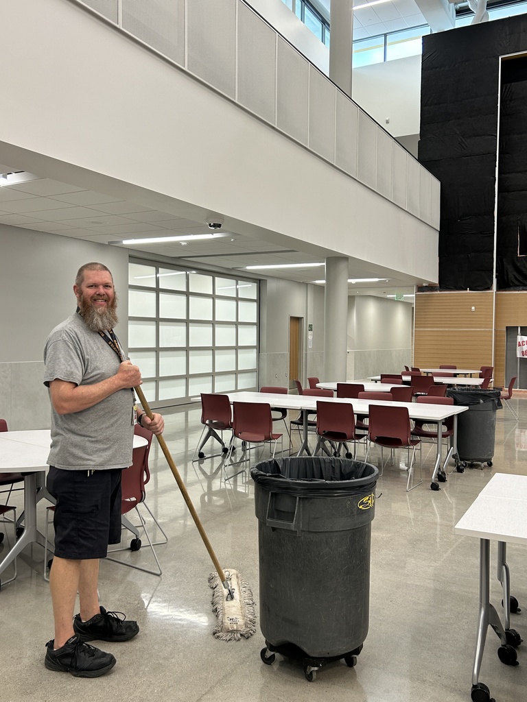 Mr. Wagner with a push mop.