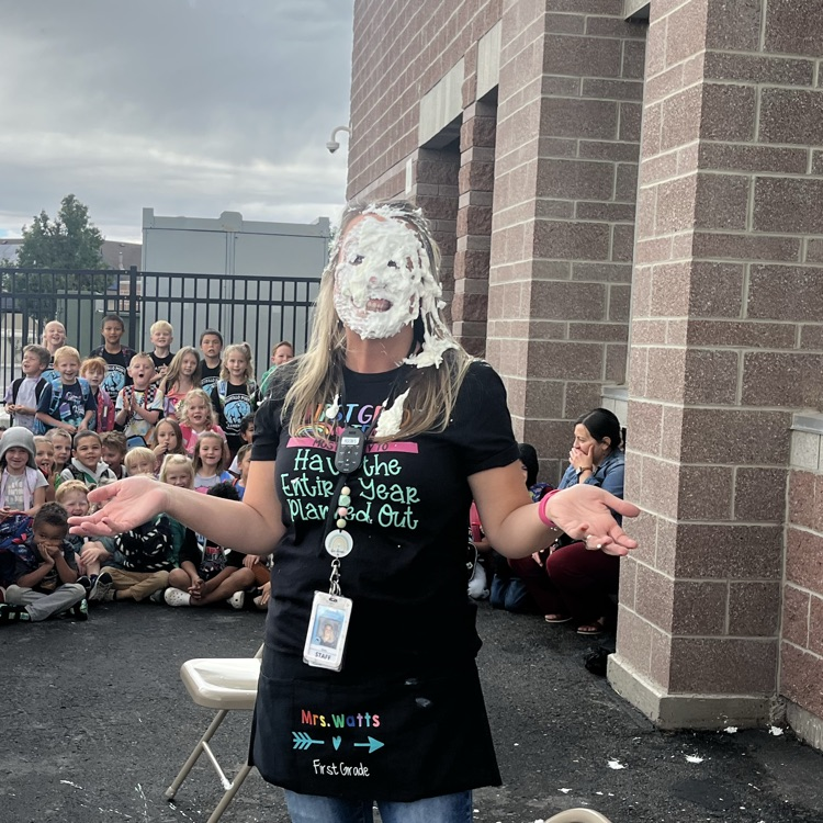 student putting pie in teacher’s face