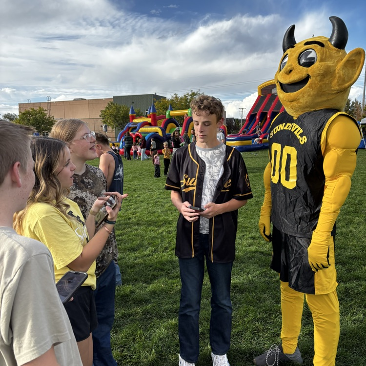Sunset Junior High mascot Sunny the Sundevil with teenagers