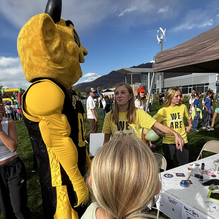 Sunset Junior High mascot Sunny the Sundevil talks to teenagers