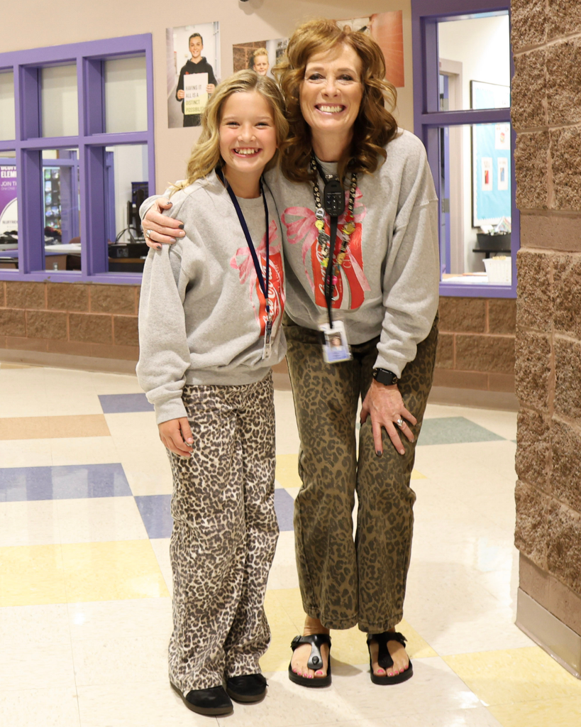 A student and their teacher wearing twinning outfits.