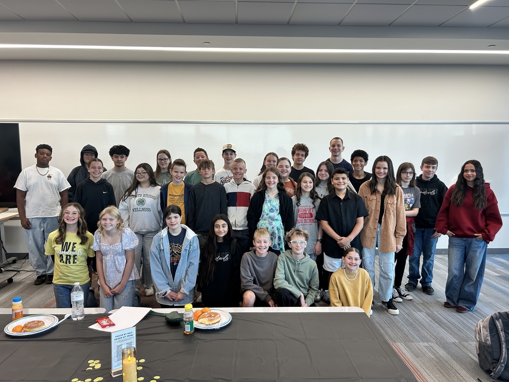 A group of teenagers posing for the camera.