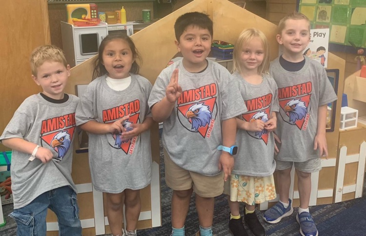 Group of students wearing their Amistad shirt!