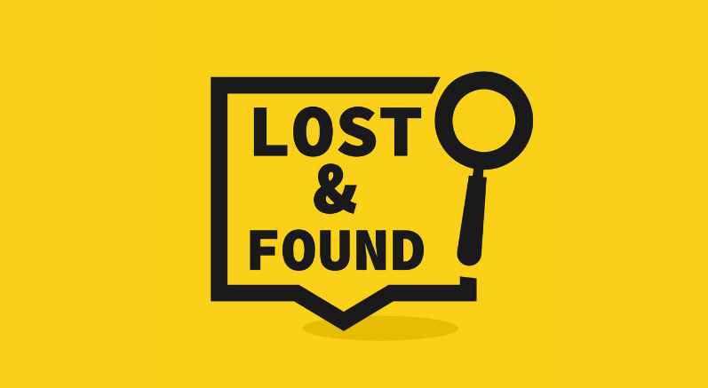 yellow background with black box and magnifying glass. Lost and found black text.