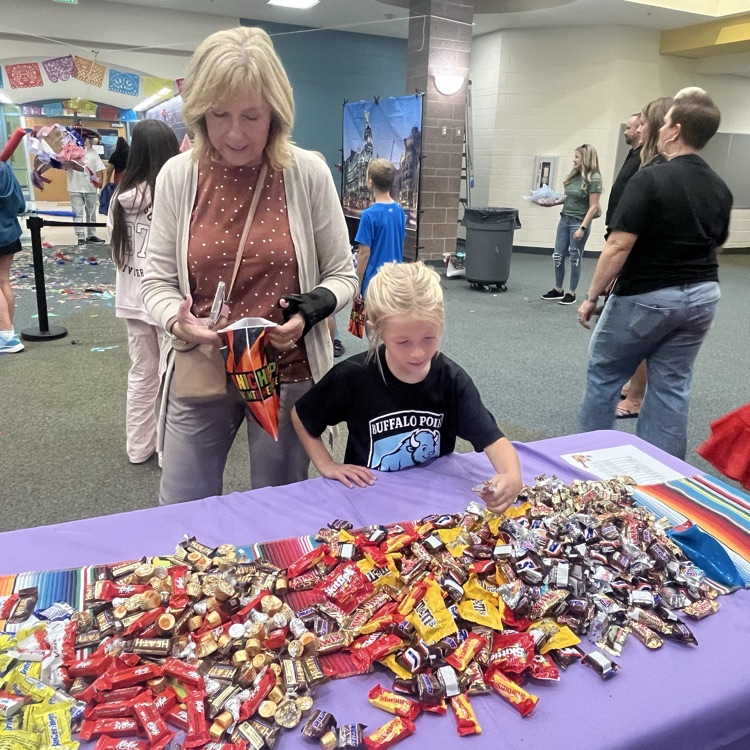 student and grown-up at one of the tables