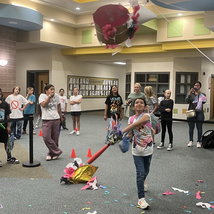 Kid hitting the piñata