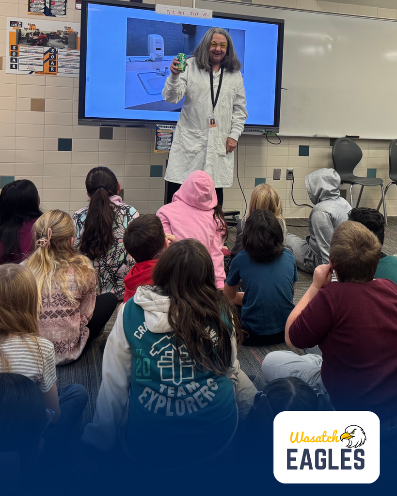 4th graders listening to the presenter talk about keeping storm drains cleaned.