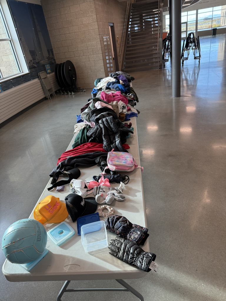 coats and other items piled on a table