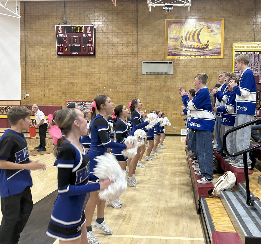 The cheerleaders and SBOs cheering on the team