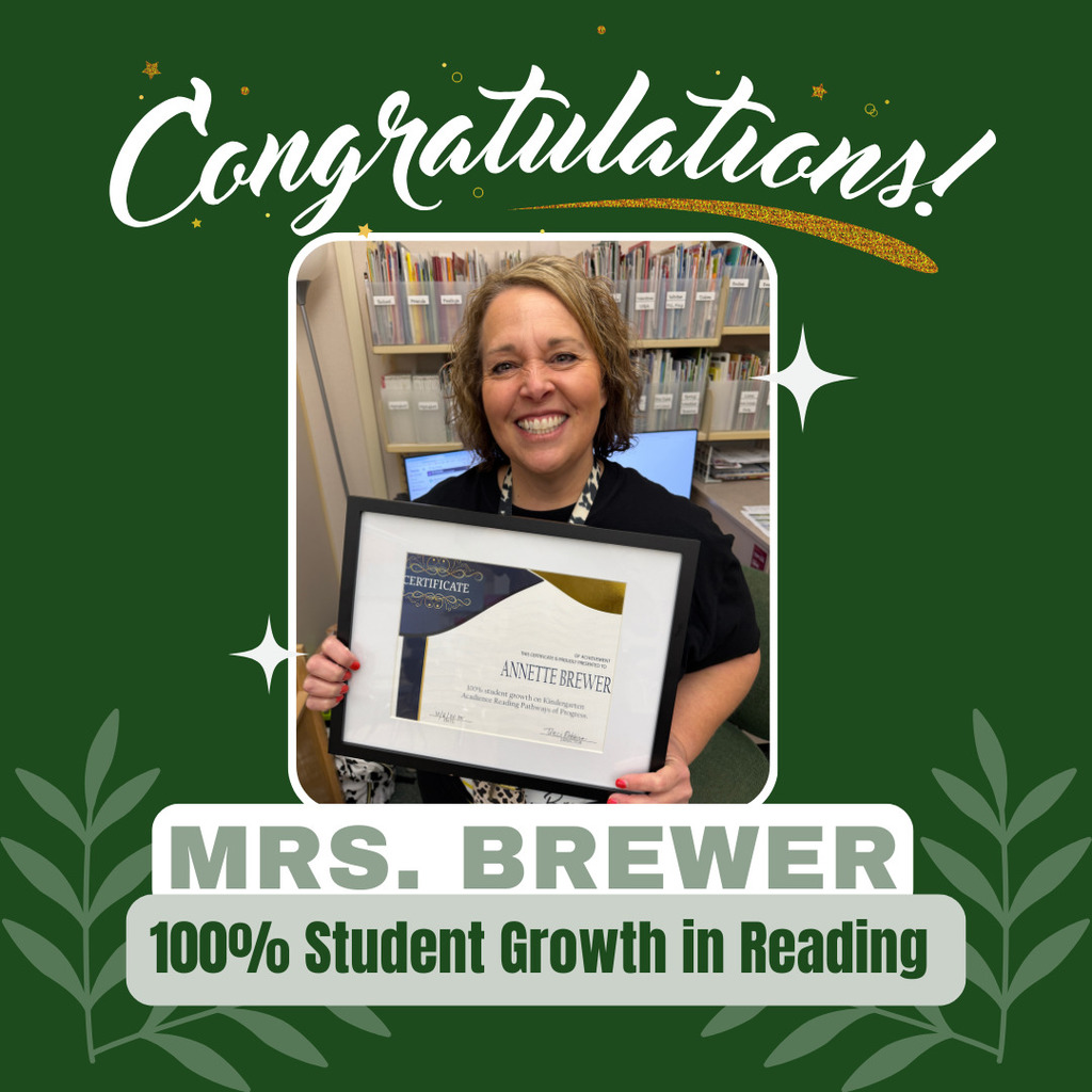 Picture of Mrs. Brewer holding a certificate from Davis School District.
