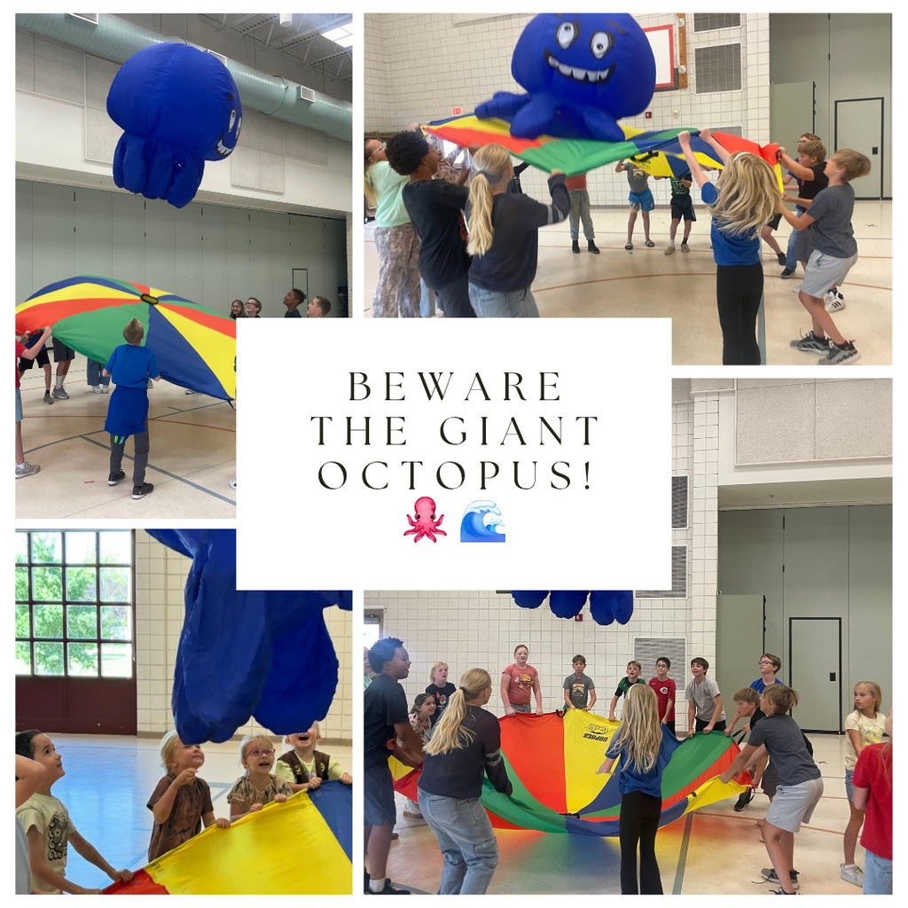 Students playing with a parachute and giant octopus.