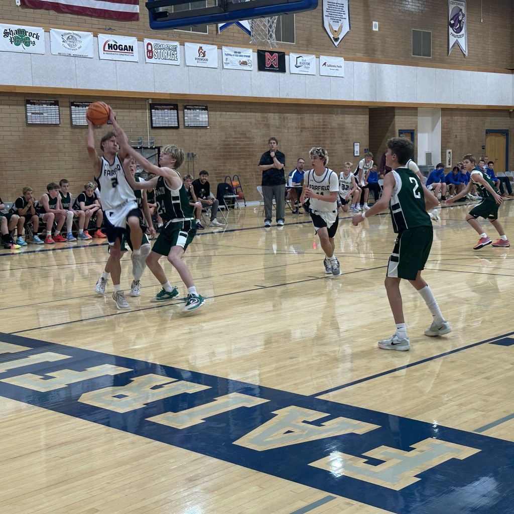 The Fairfield basketball team competing against Farmington Jr.