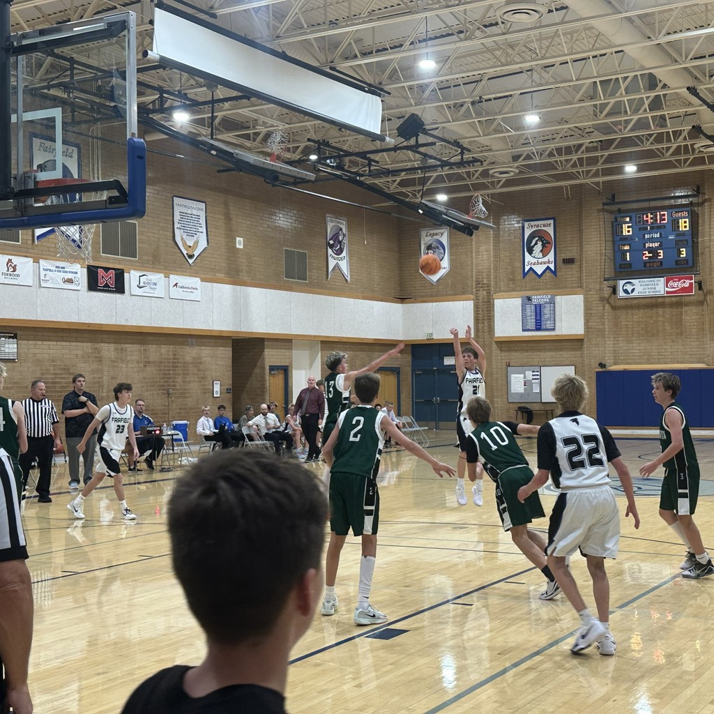 The Fairfield basketball team competing against Farmington Jr.