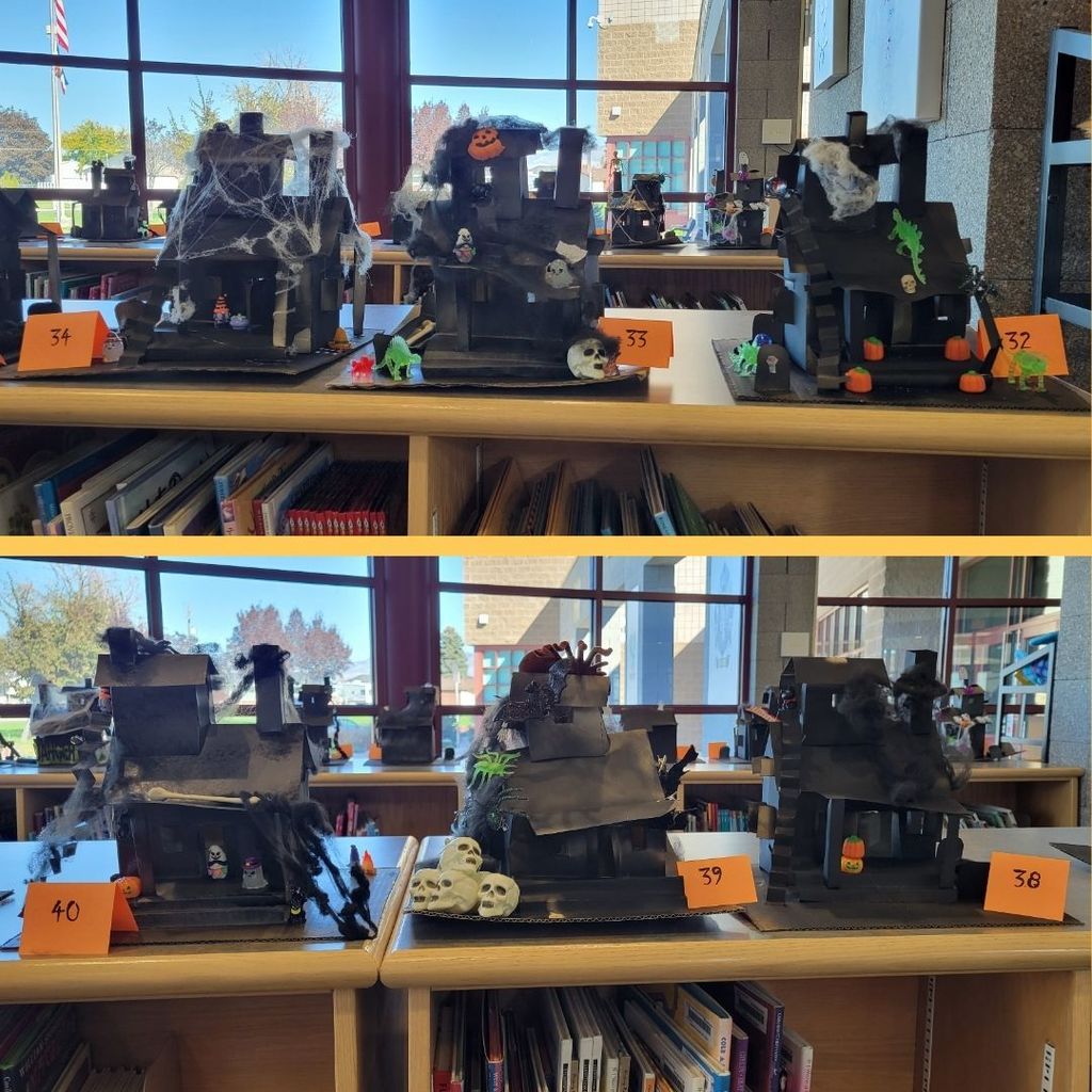 Haunted Houses constructed out of paper and decorated with various Halloween Decorations.