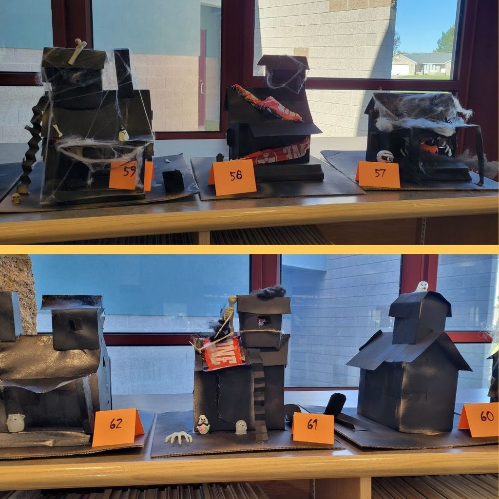 Haunted Houses constructed out of paper and decorated with various Halloween Decorations.