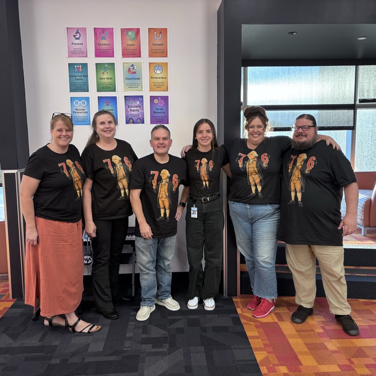 Teachers wearing their 6-7 shirts.