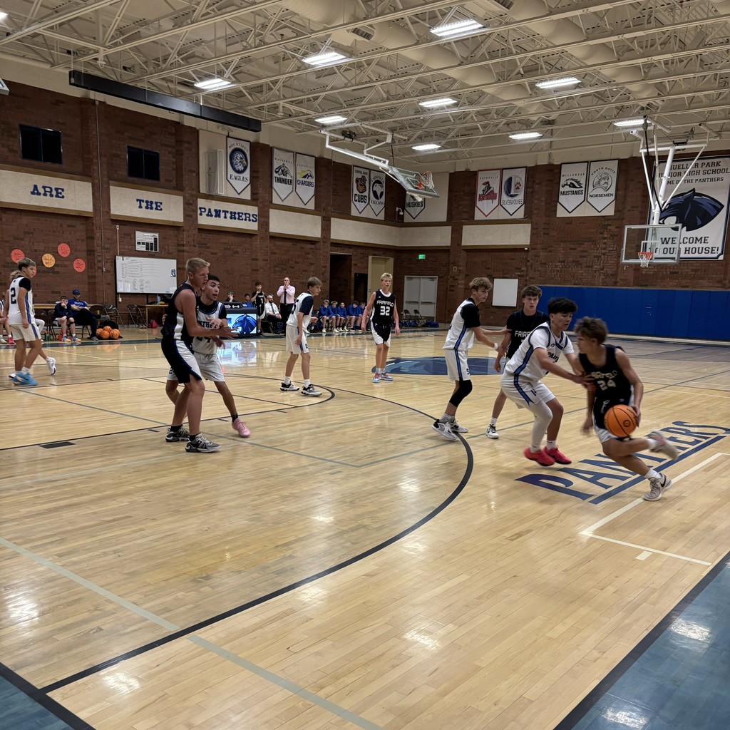 Fairfield Basketball, in Black, is competing with Mueller Park in White