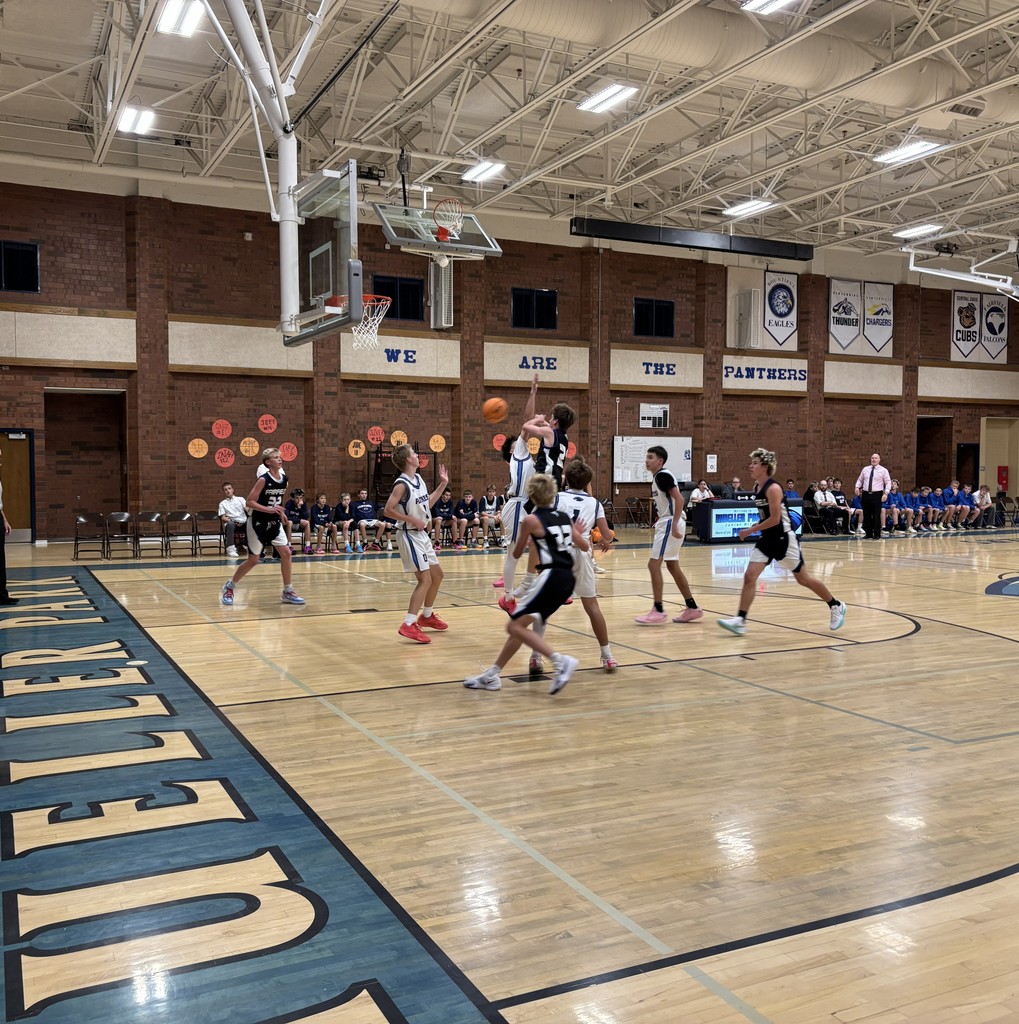 Fairfield Basketball, in Black, is competing with Mueller Park in White