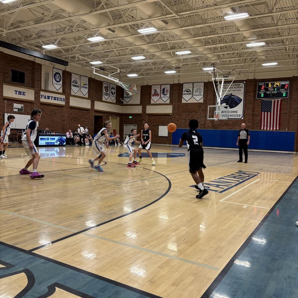 Fairfield Basketball, in Black, is competing with Mueller Park in White