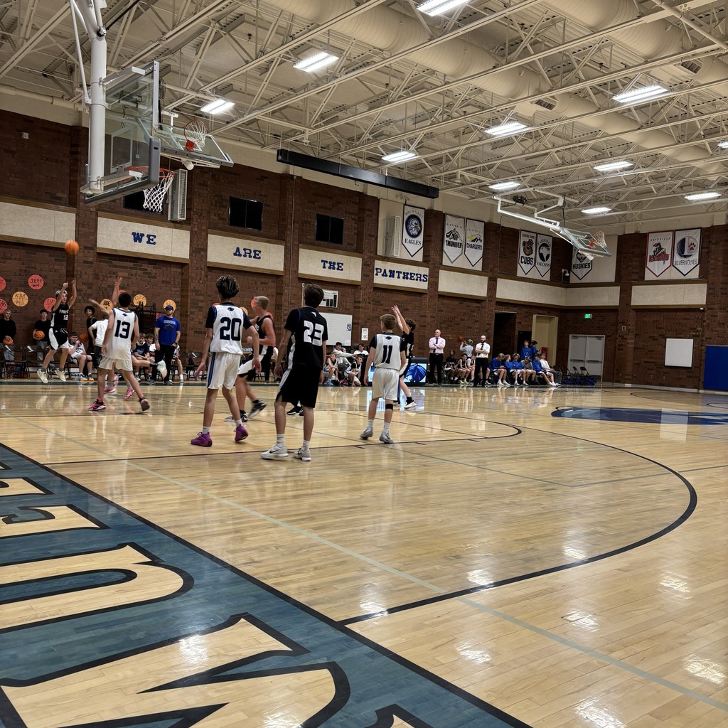 Fairfield Basketball, in Black, is competing with Mueller Park in White