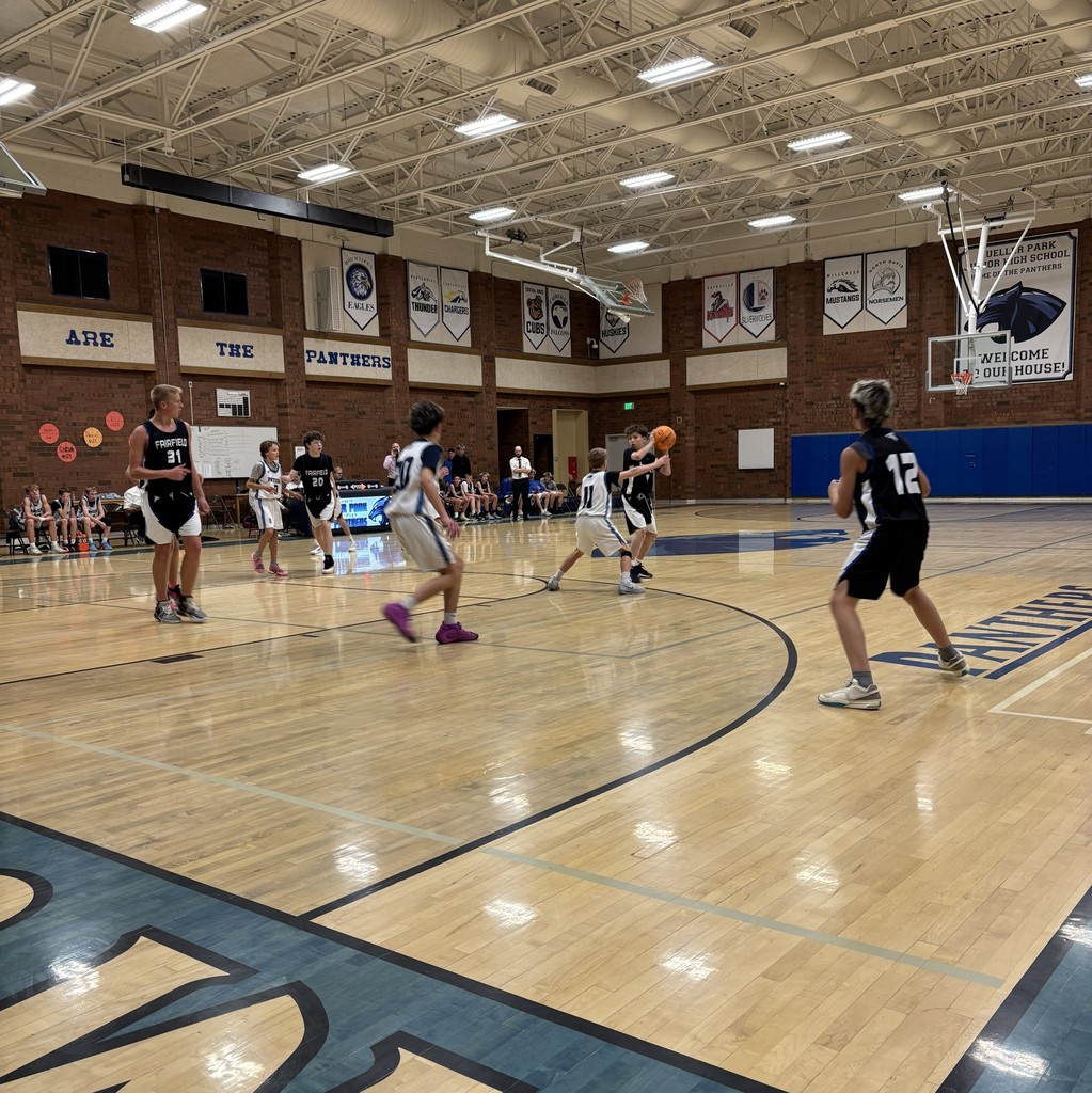 Fairfield Basketball, in Black, is competing with Mueller Park in White