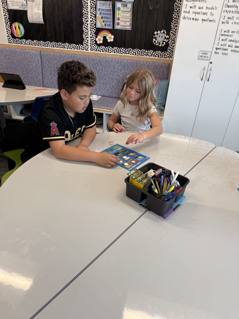 boy and girl playing a bingo game