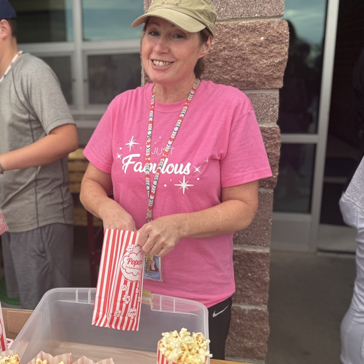 Miss Mindy filling popcorn at the fundraiser